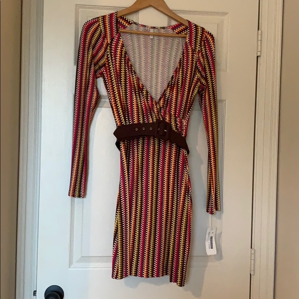 Women’s long sleeve wrap dress with belt.
